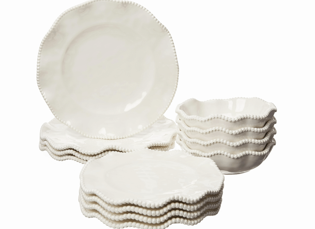 a stack of white plates and bowls